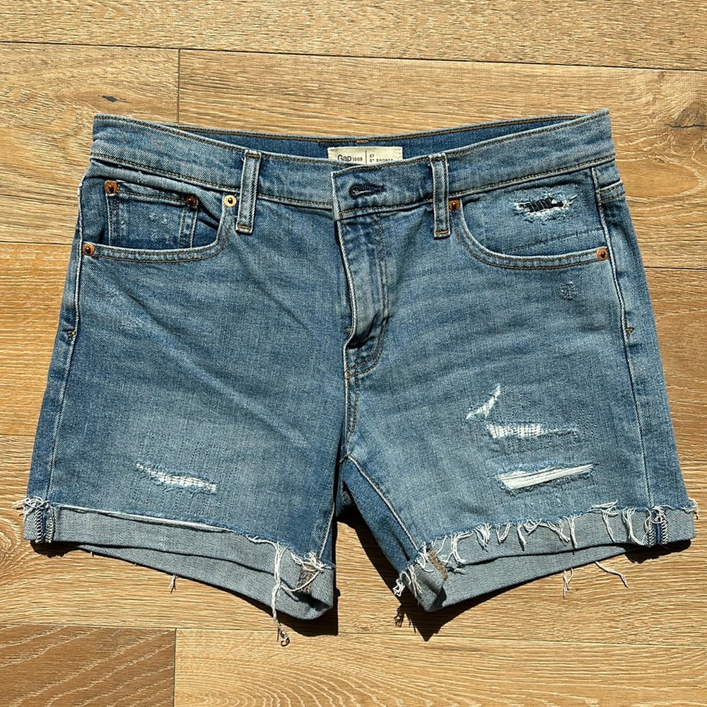 Gap 5” Jean shorts cuffed. Cut hem either rips.